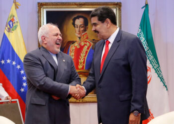 Venezuela's President Nicolas Maduro and Iran's Foreign Minister Mohammad Javad Zarif shake hands during their meeting in Caracas, Venezuela July 20, 2019. Miraflores Palace/Handout via REUTERS ATTENTION EDITORS - THIS PICTURE WAS PROVIDED BY A THIRD PARTY.