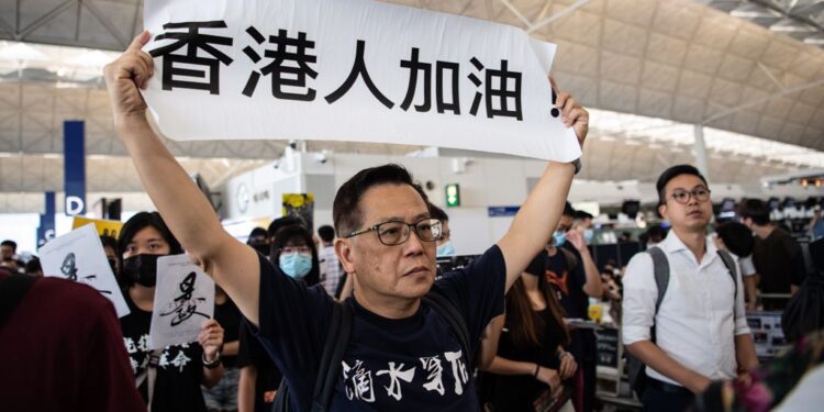 Anti-government protesters sit-in at Hong Kong airport