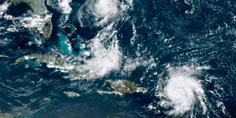 This GOES-16 satellite image taken Tuesday, Aug. 28, 209, at 17:20 UTC and provided by National Oceanic and Atmospheric Administration (NOAA), shows Dorian, a Category 1 hurricane, crossing over the U.S. and British Virgin Islands. Forecasters say it could grow to Category 3 status as it nears the U.S. mainland as early as the weekend.  (NOAA via AP)