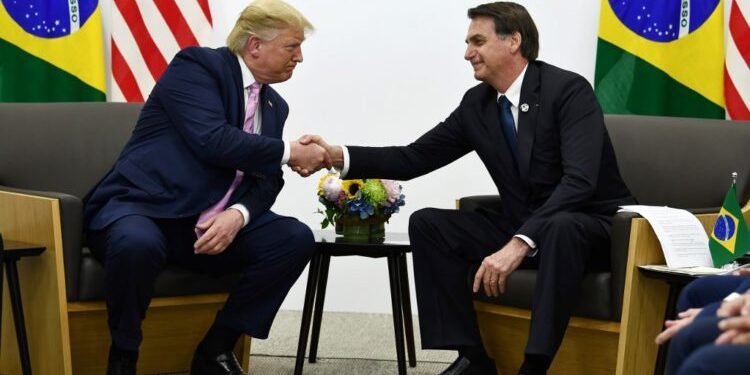 Brazil's President Jair Bolsonaro (R) meets with US President Donald Trump during a bilateral meeting on the sidelines of the G20 Summit in Osaka on June 28, 2019. (Photo by Brendan Smialowski / AFP)