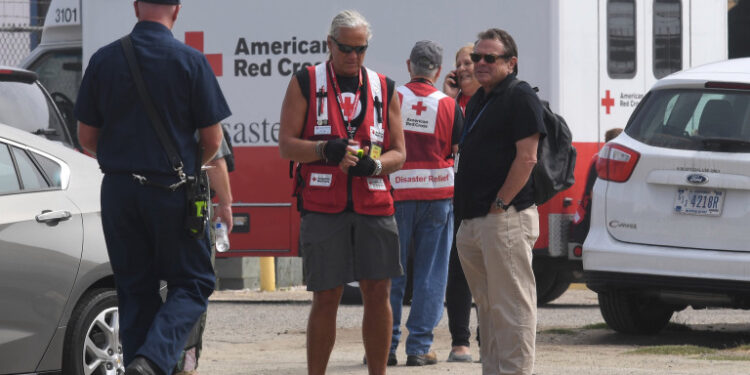 Rescue workers wait at the command center near the US Coast Guard Station Channel Islands in Oxnard, California on September 2, 2019. - A commercial scuba-dive boat sank amid intense flames early off the coast of Southern California and 34 passengers were unaccounted for, the US Coast Guard said. Five Conception crew members were awake and jumped into the water when flames burst out around 3:15 am (1015 GMT), Coast Guard Captain Monica Rochester told reporters in a televised briefing. She said 34 people -- not the 33 reported earlier by the Coast Guard -- were unaccounted for when the Conception sank 20 yards (meters) offshore, leaving only its bow exposed. (Photo by Mark RALSTON / AFP)