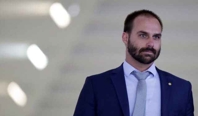 Brazilian Federal Deputy Eduardo Bolsonaro is seen after a meeting between Brazil's President Jair Bolsonaro and Paraguay's President Mario Abdo at the Itamaraty Palace in Brasilia, Brazil March 12, 2019. REUTERS/Ueslei Marcelino