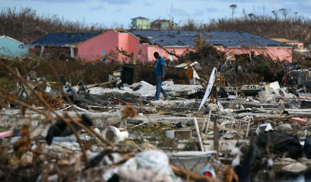 A man searches for belongings amongst debris in a destroyed neighborhood in the wake of Hurricane Dorian in Marsh Harbour, Great Abaco, Bahamas, September 8, 2019.  REUTERS/Loren Elliott