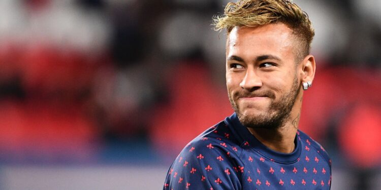 (FILES) In this file photo taken on October 07, 2018 Paris Saint-Germain's Brazilian forward Neymar smiles during warm up prior to the French L1 football match between Paris Saint-Germain (PSG) and Olympique de Lyon (OL) at the Parc des Princes stadium in Paris. A Brazilian judge on August 9, 2019 dismissed the rape case against footballer Neymar citing insufficient evidence, court sources told AFP. - The decision -- the final episode in the rape case against the Brazilian international superstar -- comes on the recommendations of prosecutors just over a month after police dropped the case citing lack of evidence. (Photo by FRANCK FIFE / AFP)