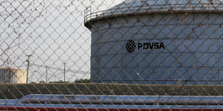 FILE PHOTO: The corporate logo of state oil company PDVSA is seen on a tank at an oil facility in Lagunillas, Venezuela January 29, 2019. REUTERS/Isaac Urrutia/File Photo