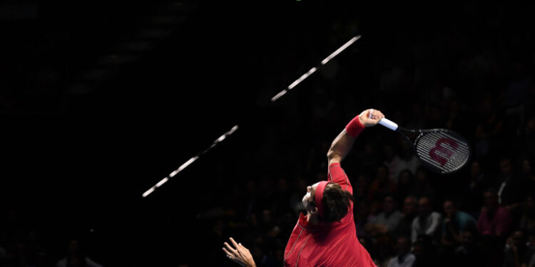 Swiss Roger Federer serves a ball to Australian Alex De Minaur during their final match at the Swiss Indoors tennis tournament in Basel on October 27, 2019. (Photo by FABRICE COFFRINI / AFP)