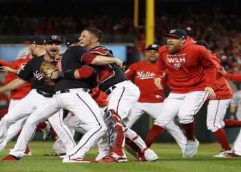 WASHINGTON, DC - OCTOBER 15: The Washington Nationals celebrate winning game four and the National League Championship Series against the St. Louis Cardinals at Nationals Park on October 15, 2019 in Washington, DC.   Patrick Smith/Getty Images/AFP