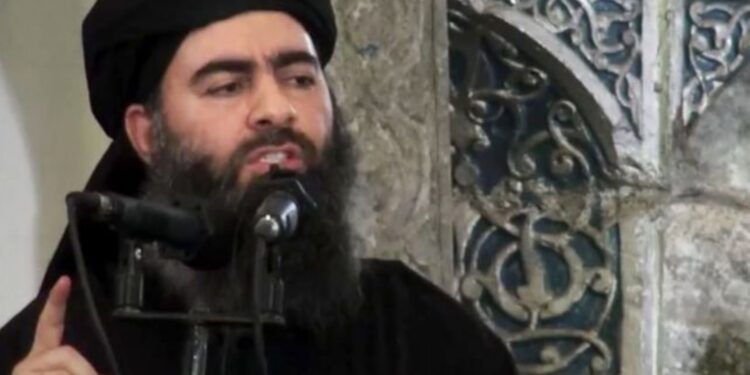 FILE - This file image made from video posted on a militant website Saturday, July 5, 2014, purports to show the leader of the Islamic State group, Abu Bakr al-Baghdadi, delivering a sermon at a mosque in Iraq during his first public appearance. The leader of the Islamic State militant network is believed dead after being targeted by a U.S. military raid in Syria. A U.S. official told The Associated Press late Saturday, Oct. 26, 2019, that Abu Bakr al-Baghdadi was targeted in Syria’s Idlib province. (AP Photo/Militant video, File)