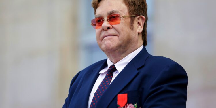 British singer-songwriter Elton John addresses a crowd in the courtyard of the Elysee Palace in Paris, on June 21, 2019, as part of a ceremony in which he was awarded the French Legion of Honour from the French president and concerts to mark France's annual "Fete de la Musique" (Music Festival). (Photo by Lewis JOLY / POOL / AFP)        (Photo credit should read LEWIS JOLY/AFP/Getty Images)