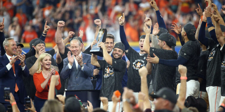 Oct 19, 2019; Houston, TX, USA; Houston Astros second baseman Jose Altuve (27) is presented the ALCS MVP Trophy after defeating the New York Yankees in game six of the 2019 ALCS playoff baseball series at Minute Maid Park. Mandatory Credit: Troy Taormina-USA TODAY Sports