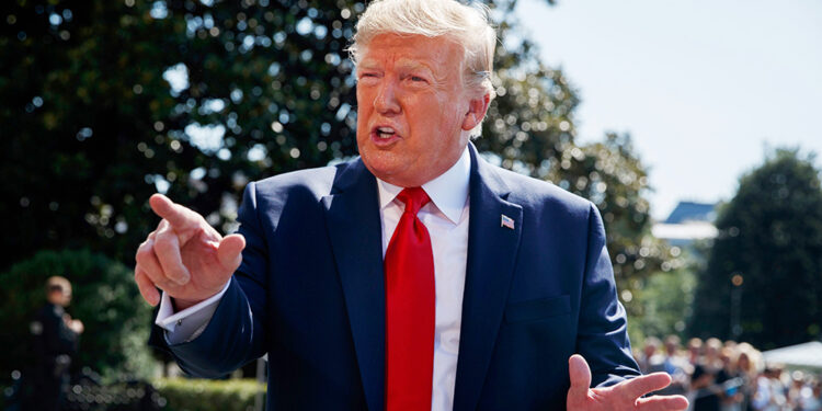 Mandatory Credit: Photo by Evan Vucci/AP/Shutterstock (10358411u)
President Donald Trump talks to reporters on the South Lawn of the White House, in Washington, as he prepares to leave Washington for his annual August holiday at his New Jersey golf club
Trump, Washington, USA - 09 Aug 2019