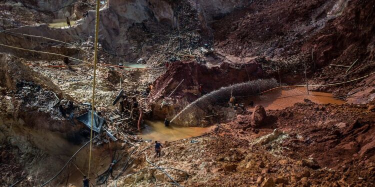 LAS CLARITAS, VENEZUELA - JULY 20, 2016:  Thousands of Venezuelans are flocking to illegal gold mines, like this one, called "Cuatro Muertos" ("Four Dead" because four miners have died here since the mine was dug) in hopes of surviving the current economic crisis by earning in gold instead of the national currency, whose value steadily falls due to the world's highest inflation.  From this remote part of the jungle the migrant miners have become the vectors of a new epidemic of malaria, because the hot, swampy conditions of the mines make for an ideal breeding ground for mosquitos. Miners spread the disease as they return home with earnings or pay visits to family members. Dozens of miners that work in this mine said that they have contracted malaria multiple times, some even dozens of times. The economic crisis has also left the government without the financial resources to control the disease - they are unable to fumigate homes, provide medicines to everyone that is sick, or even to test all patients with symptoms of malaria in many places. PHOTO: Meridith Kohut for The New York Times