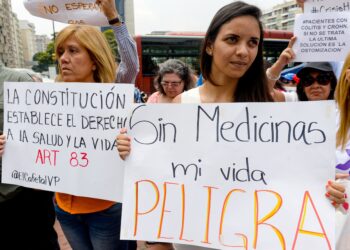 Activists take part in an anti-government demonstration protesting for the shortage of medicaments in Caracas on March 31, 2016. AFP PHOTO/FEDERICO PARRA / AFP / FEDERICO PARRA        (Photo credit should read FEDERICO PARRA/AFP/Getty Images)