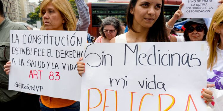 Activists take part in an anti-government demonstration protesting for the shortage of medicaments in Caracas on March 31, 2016. AFP PHOTO/FEDERICO PARRA / AFP / FEDERICO PARRA        (Photo credit should read FEDERICO PARRA/AFP/Getty Images)