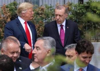 U.S. President Donald Trump, Turkish President Tayyip Erdogan and Canada's Prime Minister Justin Trudeau are seen at the start of the NATO summit in Brussels, Belgium July 11, 2018.   REUTERS/Reinhard Krause