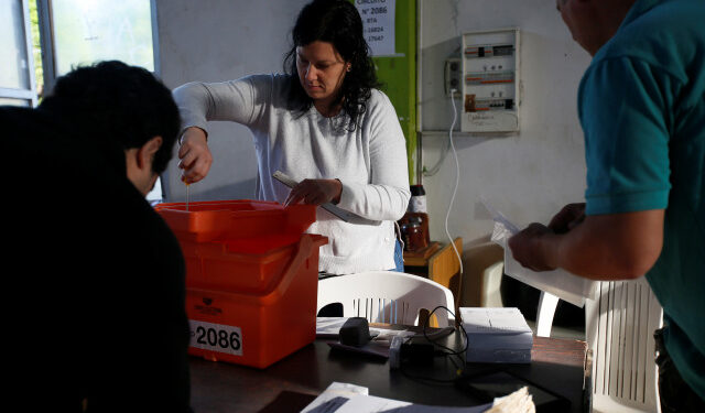 Electoral workers prepare a polling station in El Cerro, Montevideo, Uruguay November 24, 2019. REUTERS/Mariana Greif