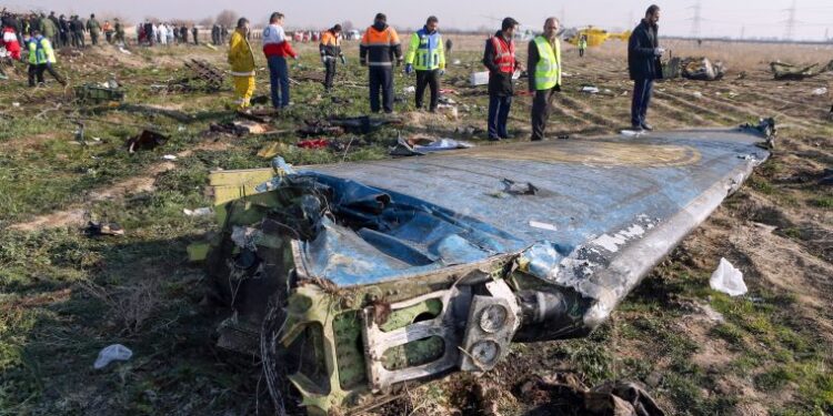 (FILES) In this file handout photo provided by the Iranian news agency IRNA on January 8, 2020, rescue teams work at the scene of a Ukrainian airliner that crashed shortly after take-off near Imam Khomeini airport in the Iranian capital Tehran. - US officials believe that Iran accidentally shot down the Ukrainian airliner, killing all of the 176 people on board, US media reported on January 9, 2020. Newsweek, CBS and CNN quoted unnamed officials saying they are increasingly confident that Iranian air defense systems accidentally downed the aircraft, based on satellite, radar and electronic data. (Photo by Akbar TAVAKOLI / IRNA / AFP) / RESTRICTED TO EDITORIAL USE - MANDATORY CREDIT "AFP PHOTO/IRNA/AKBAR TAVAKOLI" - NO MARKETING NO ADVERTISING CAMPAIGNS - DISTRIBUTED AS A SERVICE TO CLIENTS ---