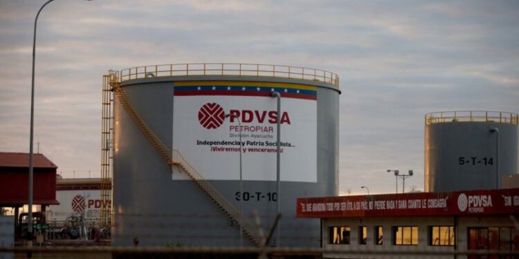 In this Feb. 18, 2015 photo, storage tanks stand in a PDVSA state-run oil company crude oil complex near El Tigre, a town located within Venezuela's Hugo Chavez oil belt, formally known as the Orinoco Belt. U.S. petroleum exports to Venezuela, much of it fuel additives to dilute the country’s heavy crude, have grown 12-fold in the past decade as domestic refineries go unmaintained. (AP Photo/Fernando Llano)