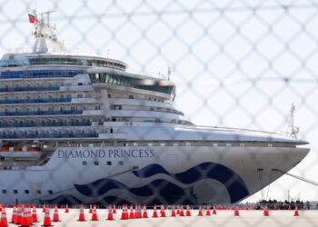 The cruise ship Diamond Princess, where dozens of passengers were tested positive for coronavirus, is seen through steel fence at Daikoku Pier Cruise Terminal in Yokohama, south of Tokyo, Japan, February 11, 2020. REUTERS/Issei Kato