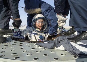 This NASA handout photo shows NASA astronaut Christina Koch as she is helped out of the Soyuz MS-13 spacecraft just minutes after she, Roscosmos cosmonaut Alexander Skvortsov, and ESA astronaut Luca Parmitano, landed in a remote area near the town of Zhezkazgan, Kazakhstan on February 6, 2020. - Koch returned to Earth after logging 328 days in space --- the longest spaceflight in history by a woman --- as a member of Expeditions 59-60-61 on the International Space Station. Skvortsov and Parmitano returned after 201 days in space where they served as Expedition 60-61 crew members onboard the station. (Photo by Bill INGALLS / NASA / AFP) / RESTRICTED TO EDITORIAL USE - MANDATORY CREDIT "AFP PHOTO /NASA?BILL INGALLS/HANDOUT " - NO MARKETING - NO ADVERTISING CAMPAIGNS - DISTRIBUTED AS A SERVICE TO CLIENTS