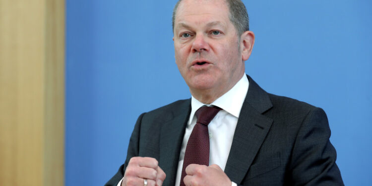 German Finance Minister Olaf Scholz speaks during a joint press conference on the supplemental budget 2020 amid the novel coronavirus pandemic on March 23, 2020 in Berlin. - German ministers agreed to blast through a constitutional limit on government deficits with 156 billion euros of new borrowing to fight the impact of the novel coronavirus, Finance Minister Olaf Scholz said. (Photo by Michael Sohn / POOL / AFP)