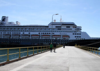The Zaandam ship cruise, sailing under the Dutch flag and operated by the Holland America (Carnival) group, with 1,800 people on board, is seen in Punta Arenas, in southern Chile, on March 16, 2020. - The cruise ship -- with 42 passengers complaining of flu-like symptoms -- is still looking on March 24 for a place for its sick passengers to disembark before continuing on to its final destination in Fort Lauderdale, Florida, via the Panama Canal. (Photo by Claudio MONGE / AFP)