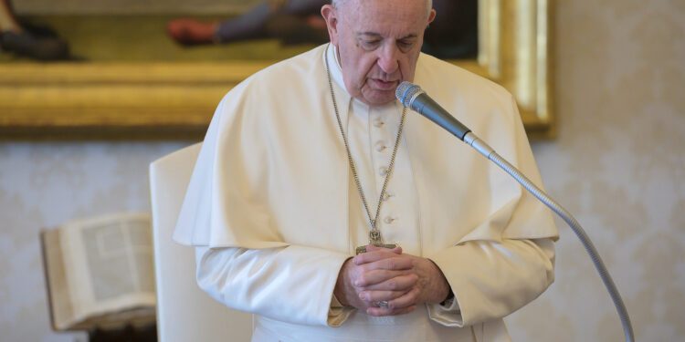 Pope Francis speaks during his general audience as it is streamed via video over the internet from a library inside the Vatican, March 25, 2020. Vatican Media/Handout via REUTERS ATTENTION EDITORS - THIS IMAGE HAS BEEN SUPPLIED BY A THIRD PARTY.