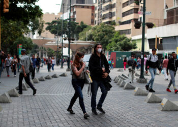 People wear protective masks in response to coronavirus (COVID-19) spread, in Caracas, Venezuela March 13, 2020. REUTERS/Carlos Jasso