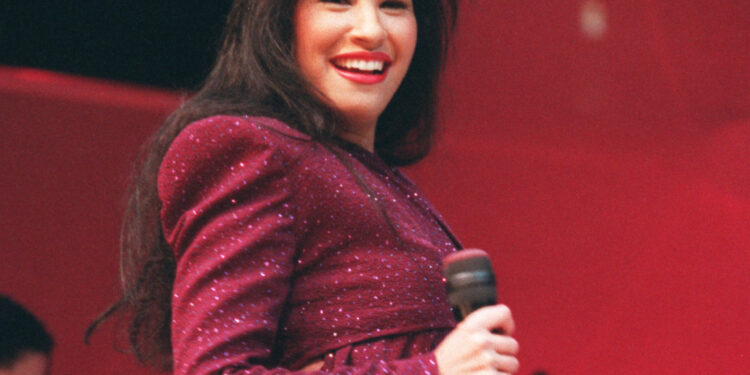 Tejano singer Selena performs at the Astrodome during the Houston Livestock Show and Rodeo on Feb. 26, 1995. (AP Photo/Houston Chronicle, John Everett)