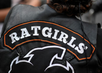 A members of female motorcycle club "Ratgirls" stands outside a bar in Caracas, on February 27, 2020. - The Ratgirls were formed in 2014 after the mixed Rats biker club decided to ban women want respect from the biker world dominated by men. (Photo by Federico PARRA / AFP)