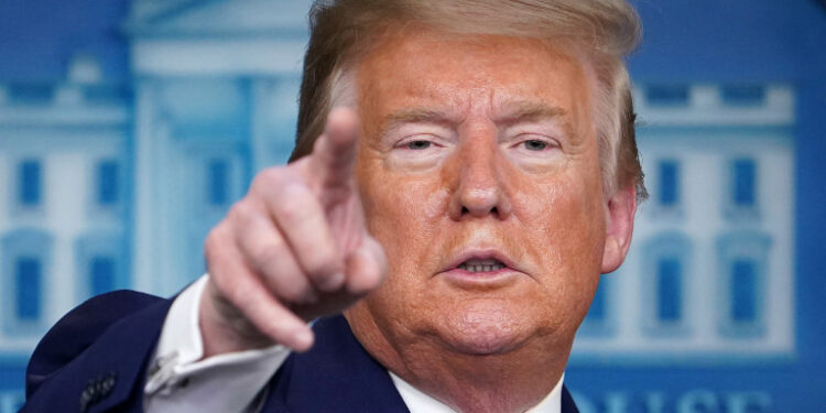 US President Donald Trump gestures as he speaks during the daily briefing on the novel coronavirus, COVID-19, in the Brady Briefing Room at the White House on April 1, 2020, in Washington, DC. (Photo by MANDEL NGAN / AFP)