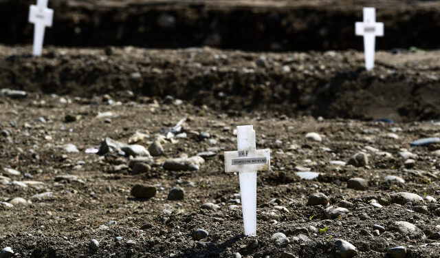 A view shows crosses in the so-called Campo 87 area where some 60 unclaimed bodies, of people who died from coronavirus, have been burried so far by the municipality at the Maggiore cemetery in Milan on April 23, 2020, during the country's lockdown aimed at curbing the spread of the COVID-19 infection, caused by the novel coronavirus. (Photo by Miguel MEDINA / AFP)