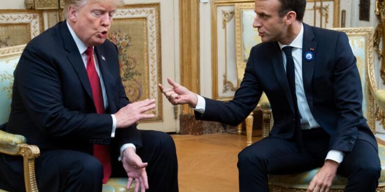 (FILES) In this file photo taken on November 10, 2018 US President Donald Trump (L) speaks with French president Emmanuel Macron prior to their meeting at the Elysee Palace in Paris, on the sidelines of commemorations marking the 100th anniversary of the 11 November 1918 armistice, ending World War I. - US President Donald Trump mocked Emmanuel Macron November 13, 2018 for his "very low" 26 percent approval rating, saying the French president only suggested creating a European army to "get onto another subject." "The problem is that Emmanuel suffers from a very low Approval Rating in France," Trump tweeted after criticizing Macron for advocating a European army to protect the continent from Russia, China and the United States."By the way, there is no country more Nationalist than France, very proud people-and rightfully so!" the US leader tweeted. "MAKE FRANCE GREAT AGAIN!" (Photo by SAUL LOEB / AFP)