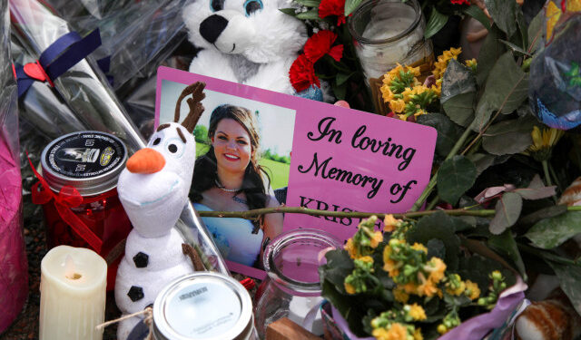 A photograph of Kristen Beaton, who was expecting her third child and was killed along Plains Road during Sunday’s mass shooting, is seen at a makeshift memorial in Debert, Nova Scotia, Canada April 23, 2020. REUTERS/Tim Krochak