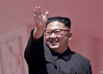 FILE - In this Sunday, Sept. 9, 2018 file photo, North Korean leader Kim Jong Un waves after a parade for the 70th anniversary of North Korea's founding day in Pyongyang, North Korea. North Korea says leader Kim has observed a successful testing of a "newly developed high-tech tactical" weapon. The report Friday, Nov. 16, 2018, from state media didn't say what sort of weapon it was, although it didn't appear to be a nuclear or missile related test. (AP Photo/Kin Cheung, File)
