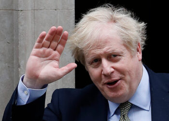 (FILES) In this file photo taken on March 18, 2020 Britain's Prime Minister Boris Johnson leaves 10 Downing Street in central London. - Britain's Prime Minister Boris Johnson appeared to be on the road to recovery as Downing Street said the Prime Minister had returned to the ward at St Thomas' Hospital after spending three nights in the intensive care unit. (Photo by Adrian DENNIS / AFP)