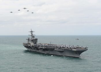 150322-N-ZF573-140 ATLANTIC OCEAN (March 22, 2015) Aircraft from Carrier Air Wing 1 fly in formation over the Nimitz-class aircraft carrier USS Theodore Roosevelt (CVN 71) during an airpower demonstration March 22, 2015. Theodore Roosevelt, homeported in Norfolk, is conducting naval operations in the U.S. 6th Fleet area of operations in support of U.S. national security interests in Europe. (U.S. Navy photo by Mass Communication Specialist 2nd Class Chris Brown/Released)