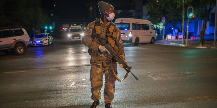 A South African soldier enforces the lockdown order in downtown Johannesburg on Friday.