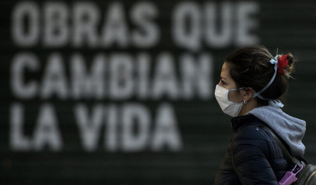 A woman wears a face mask in Buenos Aires, on April 17, 2020 amid the COVID-19 coronavirus pandemic. (Photo by JUAN MABROMATA / AFP)