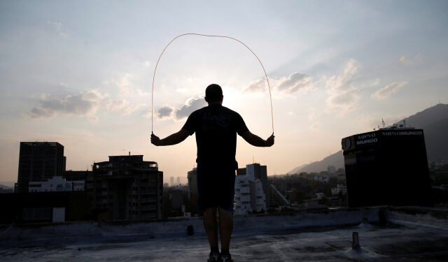 Francisco jumps rope at a rooftop during a nationwide quarantine due to the coronavirus disease (COVID-19) outbreak in Caracas, Venezuela April 7, 2020. Picture taken April 7, 2020. REUTERS/Manaure Quintero