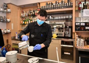 A waiter prepares a capuccino at a cafe in downtown Milan on March 10, 2020. - Italy imposed unprecedented national restrictions on its 60 million people on March 10, 2020 to control the deadly coronavirus, as China signalled major progress in its own battle against the global epidemic. (Photo by MIGUEL MEDINA / AFP) (Photo by MIGUEL MEDINA/AFP via Getty Images)