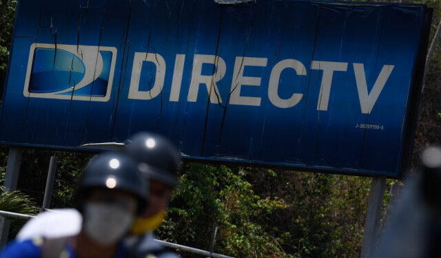 View of DirecTV broadcast satellite service provider logo at its headquarters in Caracas on May 19, 2020. - US telecommunications giant AT&T announced on Tuesday its "immediate" withdrawal from the pay television market in Venezuela, where it offered the DirecTV satellite platform, due to the impossibility of complying with the legal requirements of both countries. (Photo by Federico PARRA / AFP)