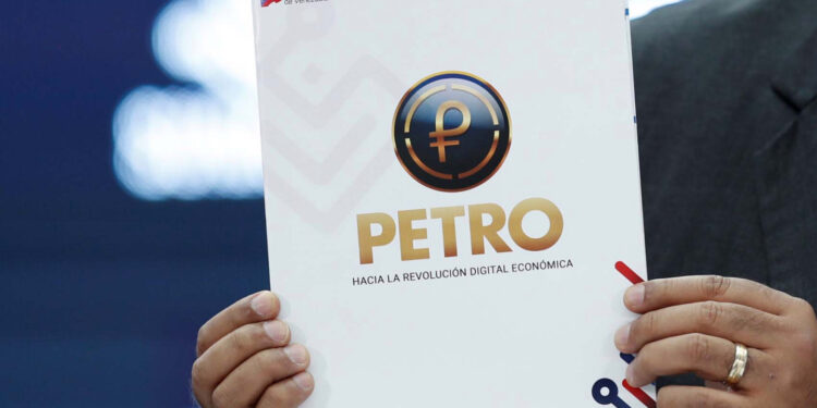 Venezuela's President Nicolas Maduro shows a document as he speaks during the kick-off event for the international trading of Petro, the cryptocurrency developed by the Venezuelan government, in Caracas, Venezuela October 1, 2018. REUTERS/Carlos Garcia Rawlins