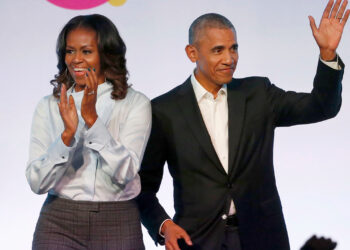 FILE - In this Oct. 31, 2017, file photo, former President Barack Obama, right, and former first lady Michelle Obama appear at the Obama Foundation Summit in Chicago. Obama said in a commencement speech Sunday, June 7, 2020, that the nationwide protests following the recent deaths of unarmed black women and men including George Floyd were fueled from "decades worth of anguish, frustration, over unequal treatment and a failure to perform police practices." (AP Photo/Charles Rex Arbogast, File)