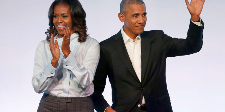 FILE - In this Oct. 31, 2017, file photo, former President Barack Obama, right, and former first lady Michelle Obama appear at the Obama Foundation Summit in Chicago. Obama said in a commencement speech Sunday, June 7, 2020, that the nationwide protests following the recent deaths of unarmed black women and men including George Floyd were fueled from "decades worth of anguish, frustration, over unequal treatment and a failure to perform police practices." (AP Photo/Charles Rex Arbogast, File)