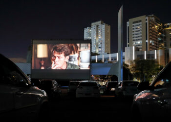 People on board their vehicles watch a movie in a drive-in theater, in Sao Paulo, Brazil, 17 June 2020. In a space enabled for about 100 vehicles at the Latin American Memorial, the inhabitants of Sao Paulo will be able to enjoy the seventh art while the cinemas in closed theaters recover their normality due to the ongoing coronavirus pandemic. EFE/ Sebastiao Moreira