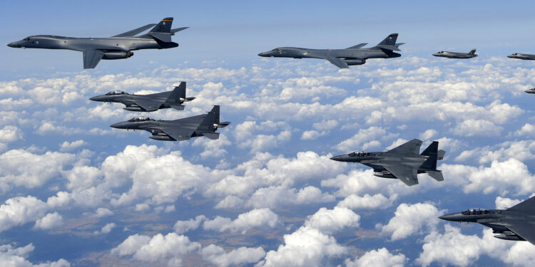 This handout photo taken on September 18, 2017 and provided by the South Korean Defence Ministry in Seoul shows US Air Force B-1B Lancer bombers (L), US F-35B stealth jet fighters (far R) and South Korean F-15K fighter jets (foreground) flying over South Korea during a joint military drill aimed to counter North Korea’s latest nuclear and missile tests.
The US flew four stealth fighter jets and two bombers over the Korean peninsula on September 18 in a show of force after North Korea's latest nuclear and missile tests, South Korea's defence ministry said. / AFP PHOTO / South Korean Defence Ministry / handout / RESTRICTED TO EDITORIAL USE - MANDATORY CREDIT "AFP PHOTO / South Korean Defence Ministry" - NO MARKETING NO ADVERTISING CAMPAIGNS - DISTRIBUTED AS A SERVICE TO CLIENTS