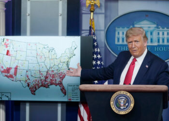 WASHINGTON, DC - JULY 23: U.S. President Donald Trump gestures to a map while speaking during a news conference about his administration's response to the ongoing coronavirus pandemic at the White House on July 23, 2020 in Washington, DC. President Trump announced new guidelines for schools to re-open as the U.S. reported more COVID-19 cases in the last two weeks (915,000) than it did during all of June.   Drew Angerer/Getty Images/AFP