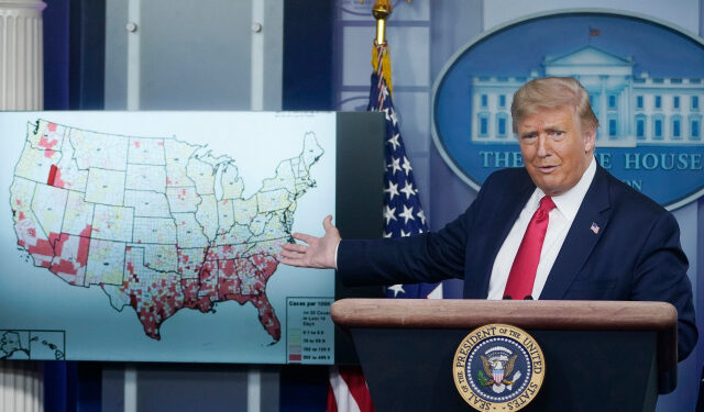WASHINGTON, DC - JULY 23: U.S. President Donald Trump gestures to a map while speaking during a news conference about his administration's response to the ongoing coronavirus pandemic at the White House on July 23, 2020 in Washington, DC. President Trump announced new guidelines for schools to re-open as the U.S. reported more COVID-19 cases in the last two weeks (915,000) than it did during all of June.   Drew Angerer/Getty Images/AFP