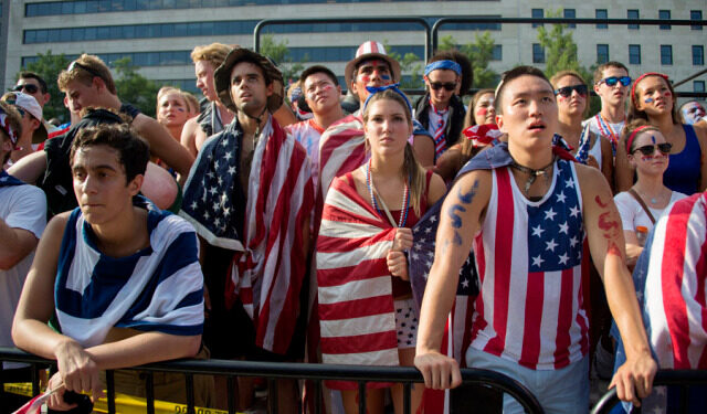 Fans react to the USA's loss to Belgium in the 2014 FIFA World Cup on Freedom Plaza in Washington, DC, July 1, 2014. Kevin De Bruyne and Romelu Lukaku's extra time goals fired Belgium past the United States with a thrilling 2-1 win and into the World Cup quarter-finals.       AFP PHOTO / Jim WATSON